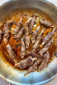 Return the beef rolls to the pan with the glaze until coated and cooked down for two minutes