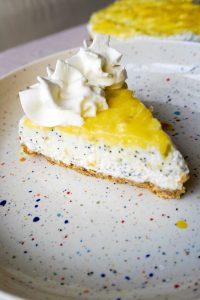No-bake lemon poppy seed cheesecake slice with lemon curd swirl